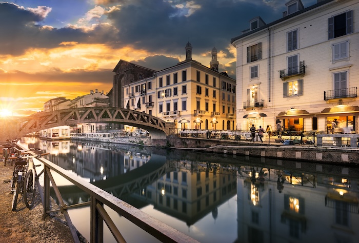 Bridge across the Naviglio Grande canal at the evening in Milan, Italy